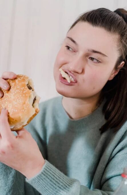 woman eating hamburger