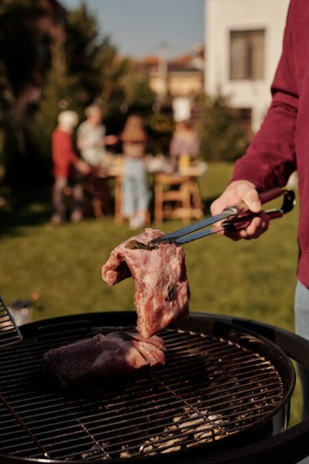 guy grilling a piece of meat