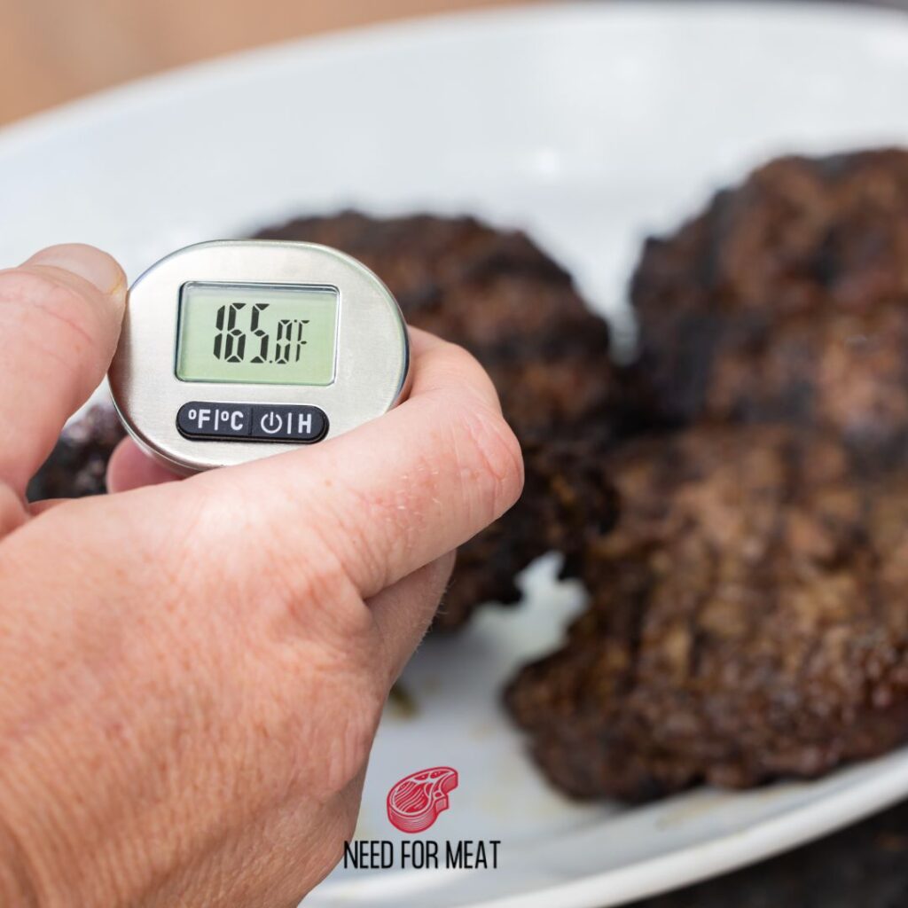 checking inner temperature of beef steak