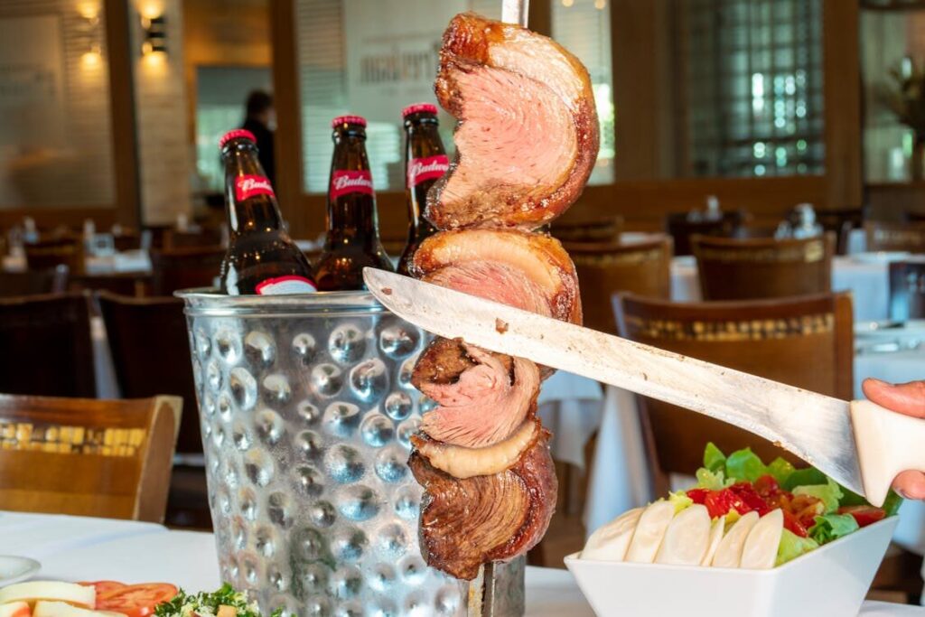 slicing picanha with a knife