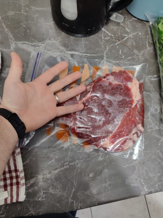 rump steak seasoned in zip-top plastic bag