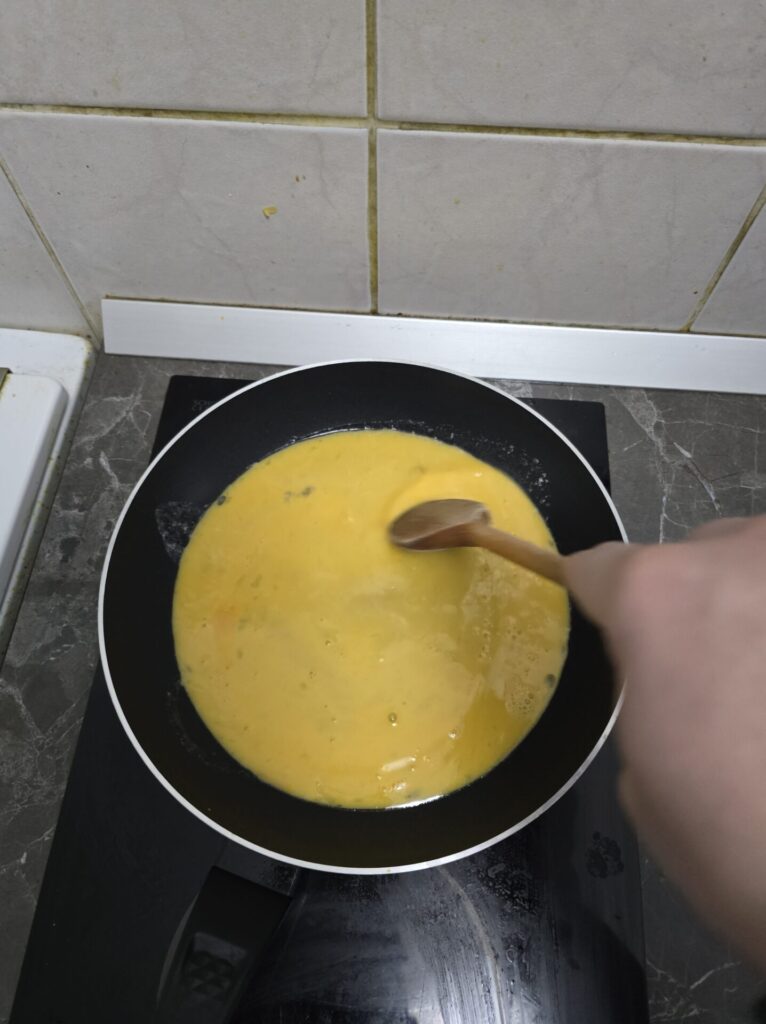 cooking scrambled eggs