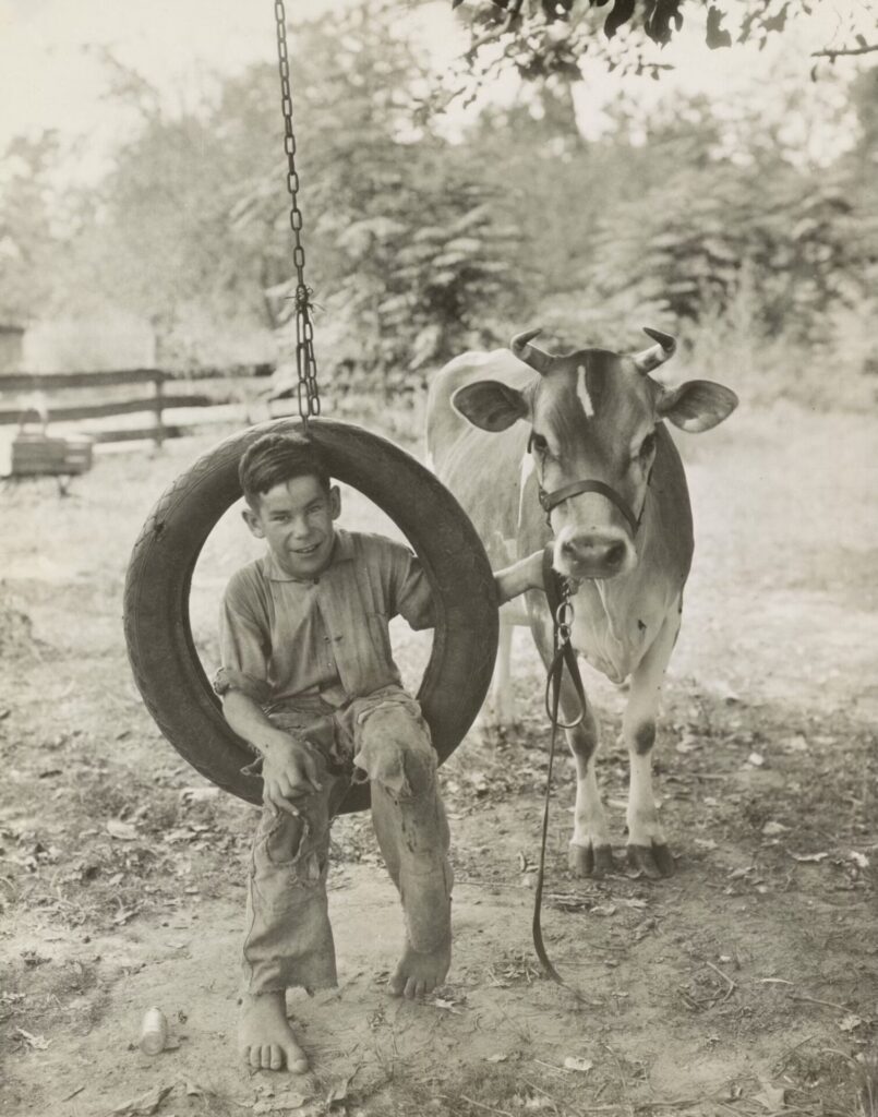 old photo of a young kid farmer