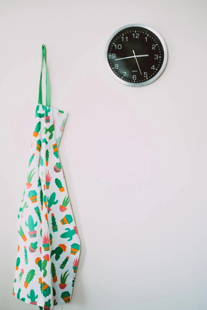 clock and kitchen apron